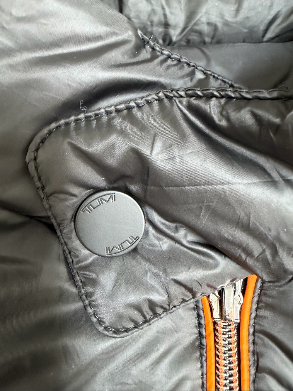 TumiPAX McLaren Packable Black Puffer Vest/Pillow with Orange Trim - Picture 2 of 12